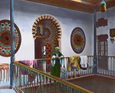 Moroccan woman in gallery, image date: circa 1910, Carl Simon Archive by Carl Simon