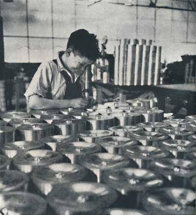 Apprentice with Microscope Testing the Hardness of Pistons, 1941 by Cecil Beaton
