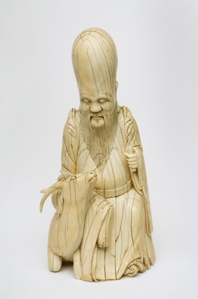 Carved Ivory figure of Shou Xing seated with deer, c.1580-1644 by Chinese School