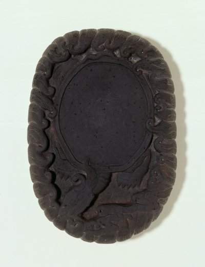 Inkstone carved as the large mythical Lo-shu tortoise among waves by Chinese School