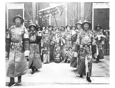 Portrait of TzU-Hsi (1835-1908) Empress Dowager of China with ladies-in-waiting and guards by Chinese School