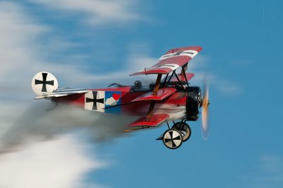Historic Red Triplane Soaring by Darek Siusta