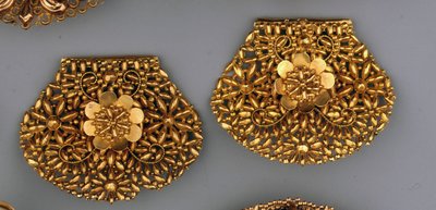 The first typically Northern Dutch-shaped ear-irons openworked and decorated with cornucopia by Dutch School