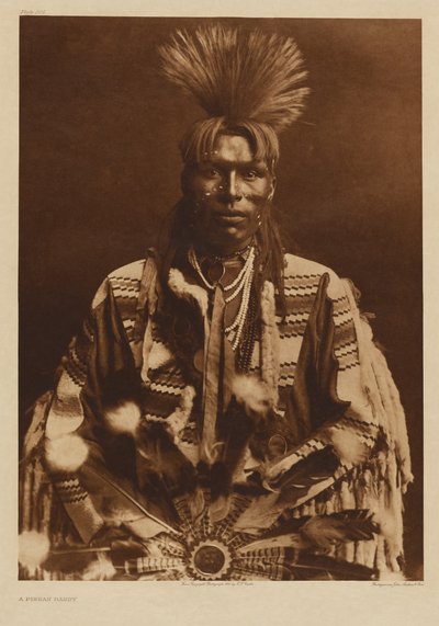 [A Piikani Man Dressed in Traditional Attire] by Edward S. Curtis