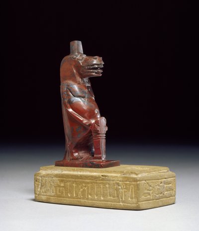 Hippopotamus goddess Taueret, holding a plait of rolled papyrus which forms the protective hieroglyphic sign, 