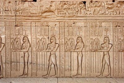 Egyptian antiquity: offerings and tributes presented to the goddess, Temple of Hathor, Denderah, Egypt by Egyptian Ptolemaic Period