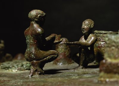 Crouching figures from a small group statue depicting Sit Shimsi, the rite to the rising sun, Elamite Period, from Susa, southwestern Iran by Elamite