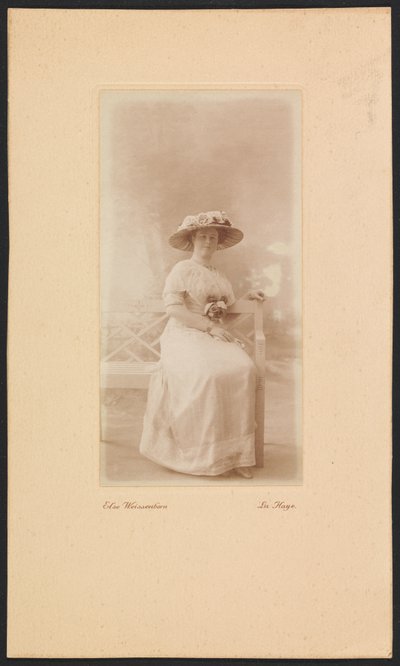Portrait of Mrs. M.C. Lucassen-Van Idsinga with Hat and Dress Sitting on a Bench by Else Weissenborn