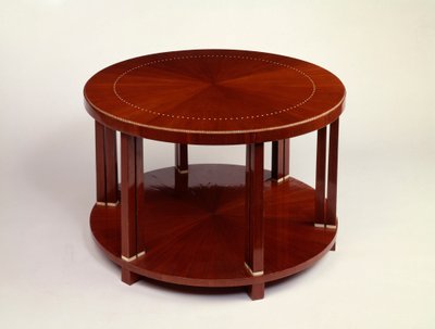A low round twin level table with rosewood veneer, inlaid with ivory by Émile Jacques Ruhlmann