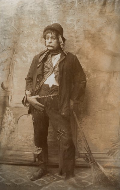 Actor dressed up as a street cleaner by English Photographer