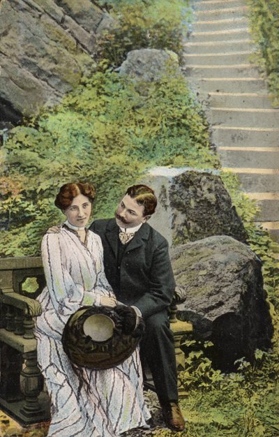 Couple seated on a stone bench near some steps by English Photographer