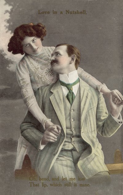 Fashionably dressed couple about to kiss by English Photographer