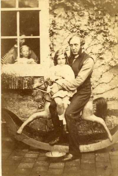 Father and Daughter Seated on a Rocking Horse with Brother and Mother Looking Through Window, 1860s by English Photographer