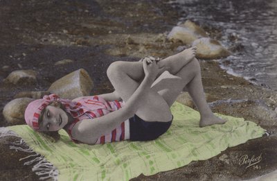 Girl Lying on Towel on Beach by English Photographer