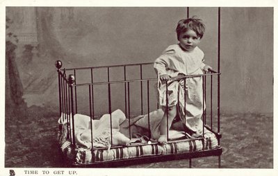 Little boy in a crib by English Photographer