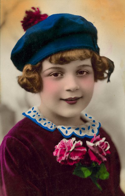 Portrait of a young girl in a blue hat by English Photographer