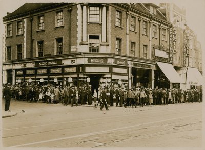 Queue for Charlie Chaplin in The Kid at The Majestic, High Street, Clapham, circa 1921 by English Photographer