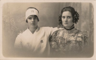 Two young women, with arms around each other