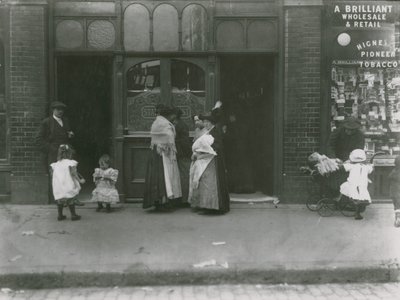 Women and Children Outside a Tavern in London by English Photographer