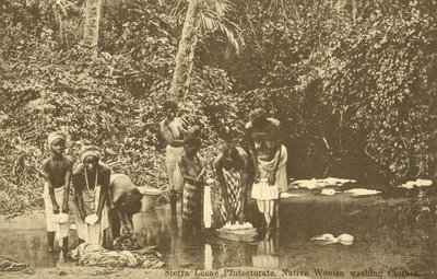 Women washing clothes in a river, Sierra Leone by English Photographer