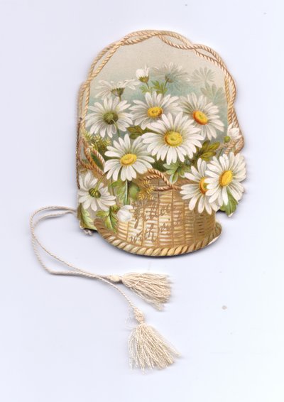 A greeting card booklet in the shape of a wicker basket filled with daisies and tied with a tassel. The text on the basket reads filled with wishes, circa 1880 by English School