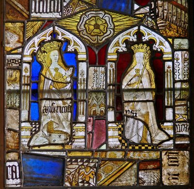A panel in the east window depicting the Cardinal Virtues: Mercy (Misericordia) and Peace (Pax) and a white rose by English School