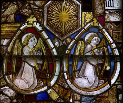 A panel in the east window depicting two musician angels with harps and a sunburst, emblem of Edward IV by English School