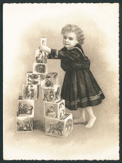 Child playing with building blocks by English School