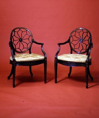 George III ebonised and gilded armchairs in the style of Chippendale, late 18th century by English School