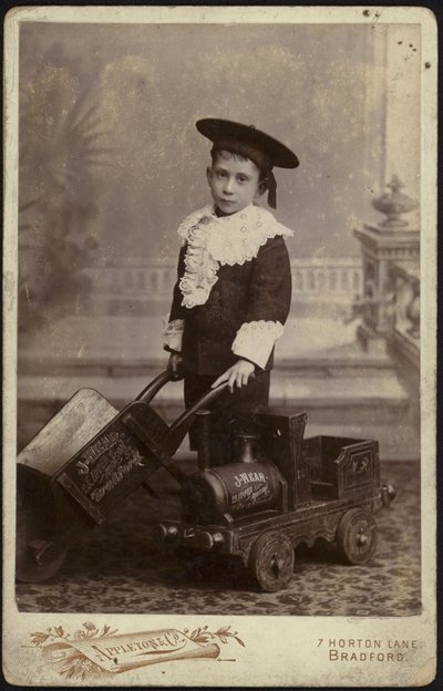 Portrait of a Young Boy Posing with a Handcart by English School