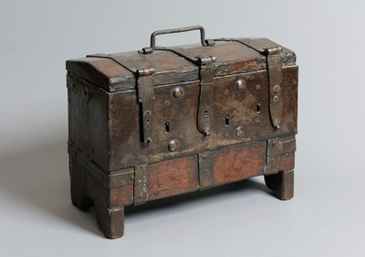 Small chest on four bracket feet with straps, three locks and handle by English School