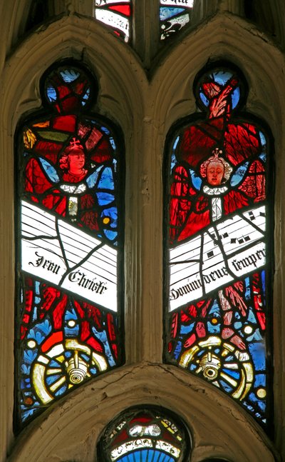 Window depicting angels on wheels with antiphons by English School