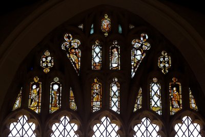 Window depicting the Tracery Lights with God, the Trinity, St Peter, St Paul, St Catherine and Gabriel, and a Bird by English School