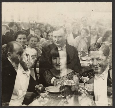 Double Exposure of a Group of People at a Banquet by Erich Salomon