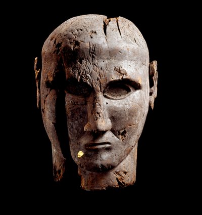 Head of a man, wood sculpture with trace of gold, 7th century BC by Etruscan