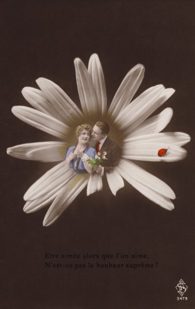 A young couple in the centre of a flower with ladybird by French Photographer