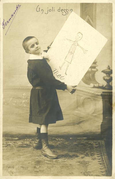 Boy with a drawing by French Photographer