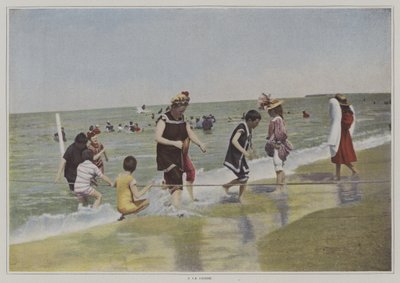 Children playing with a rope at the beach by French Photographer