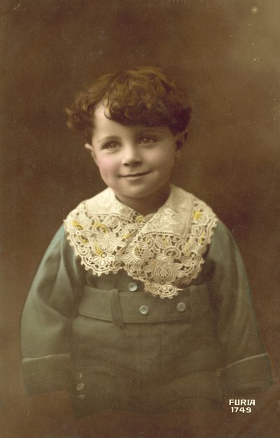 Cute boy, with a big smile by French Photographer