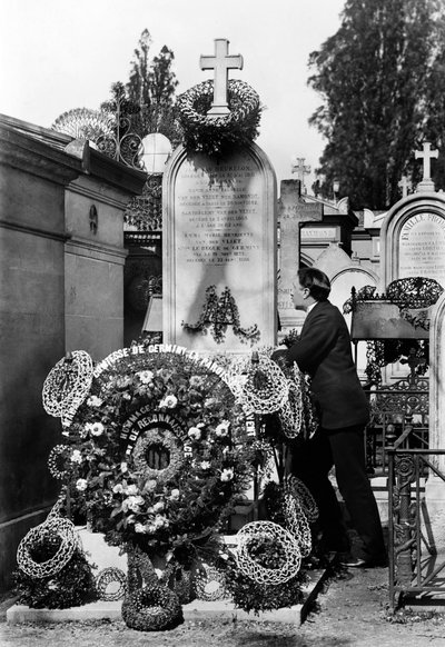 Funeral crowns and man collected in front of the tomb of Emma Van Der Vliet, Countess Le Begue De Germiny (1822-1888) by French Photographer