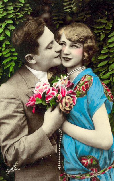 Man Carrying Flowers, Kissing Pretty Girl on the Cheek by French Photographer