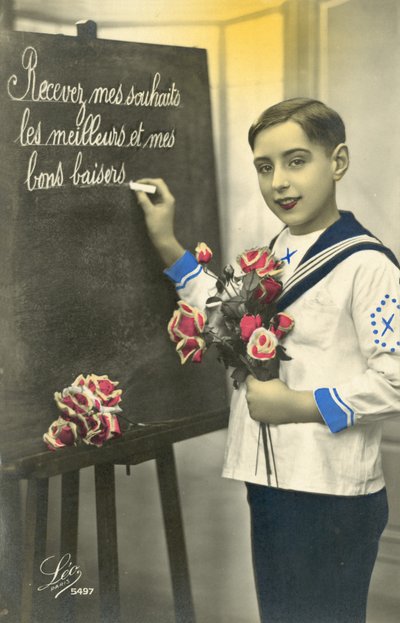 Schoolboy writing on a blackboard by French Photographer