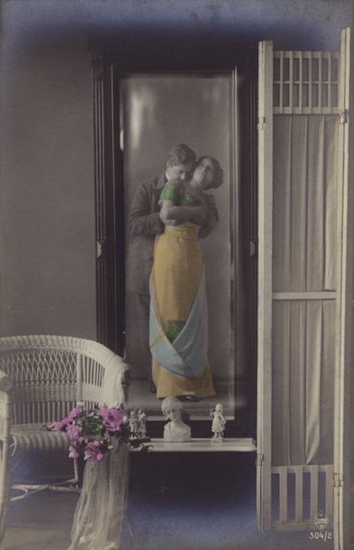 The Reflection in a Mirror of a Young Couple Kissing by French Photographer