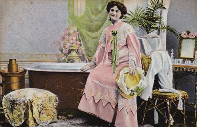 Woman sitting on edge of bath by French Photographer