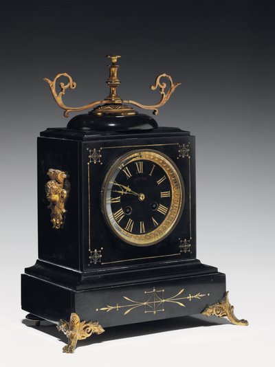A mantle clock of black composition stone, with incised decoration, with legs, finials and fittings in gilt brass, by Jausions of Pau, France, c.1876-78 by French School