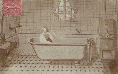 A woman in the bath in a bathroom by French School