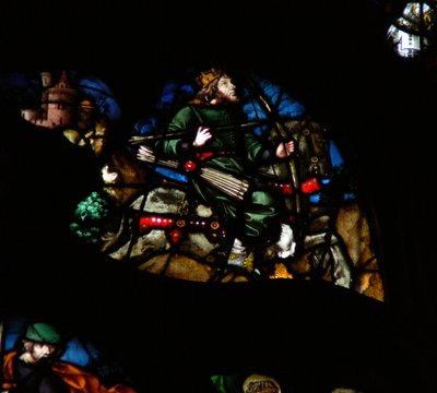 The west rose window depicting a scene from the Book of Revelation: A man on a white horse with a bow, arrows and a crown by French School