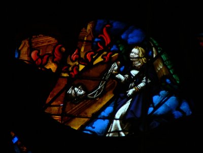 The west rose window depicting a scene from the Book of Revelation: An angel giving incense to the altar (symbolizing the prayers of the saints) by French School