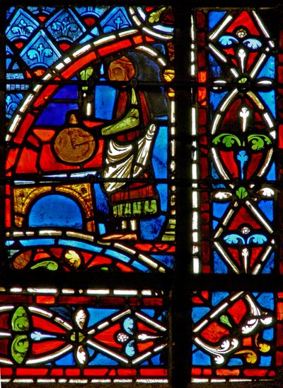 Window w11 depicting a draper donor and border panels by French School