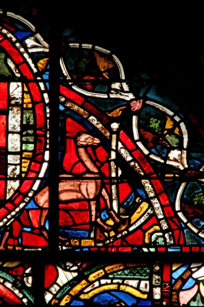 Window depicting a scene from the Prodigal Son story: a camel stands by to help him remove his inheritance by French School